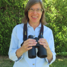 Karen Richardson holding binoculars
